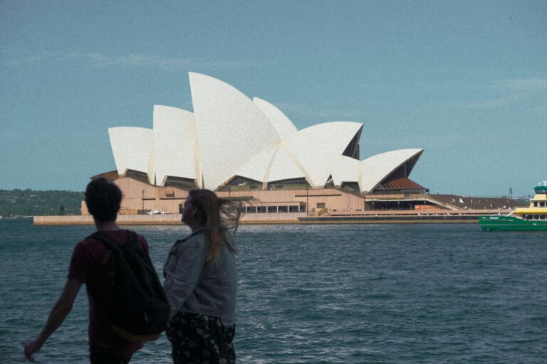 a couple people looking at a building