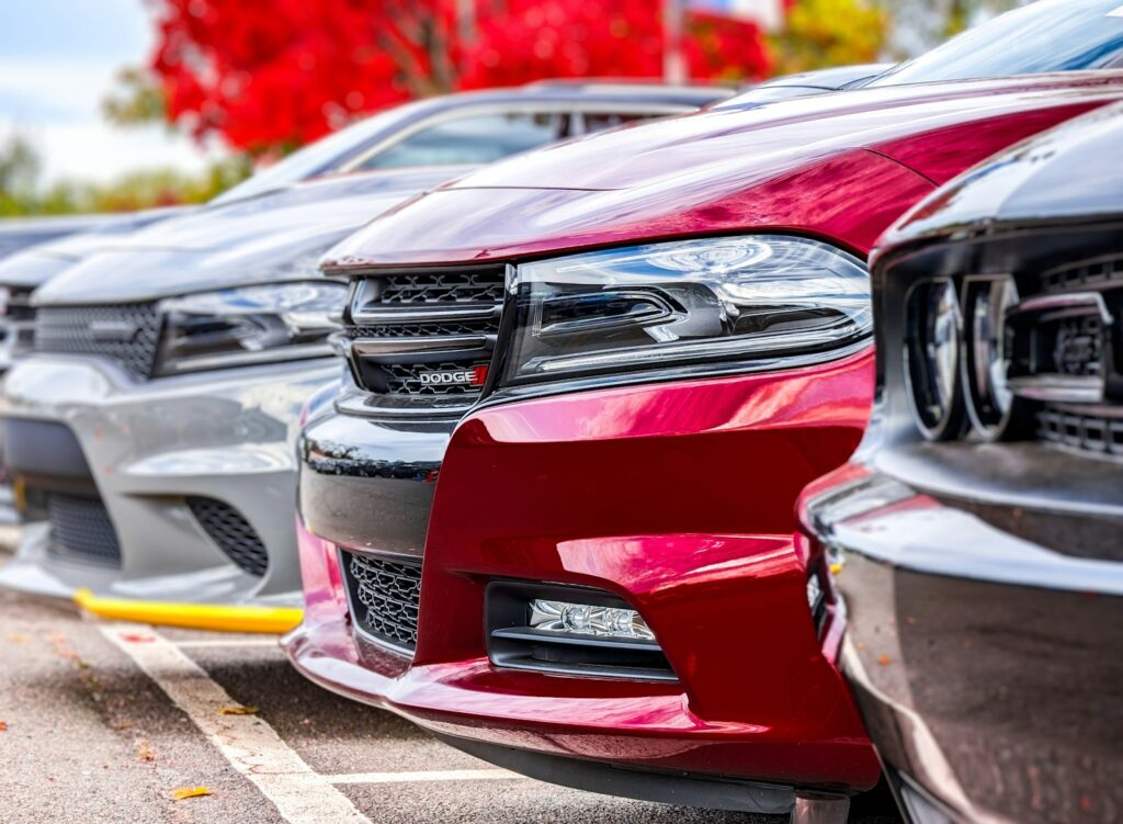 a row of parked cars in a parking lot